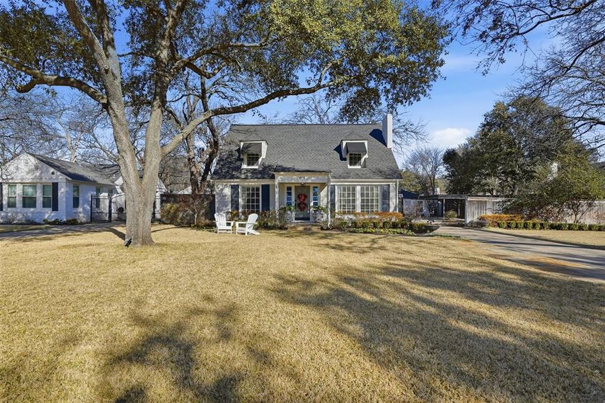 Curb appeal and timeless character meet fresh, elevated style in this beautifully updated Ridglea North home, set on an oversized lot and finished with thoughtful design at every turn. A welcoming landing and staircase—highlighted by a solid brass bannister and boxed wood trim—set the tone the moment you step inside. The front living room is bright and inviting with exposed wood beams, and a fireplace that flows seamlessly into the fully renovated dining and kitchen areas. The kitchen features marble countertops, a charming banquette, updated appliances, and a spacious walk-in pantry—blending function and style with ease. The primary suite offers a renovated bath and generous closets, while each additional bedroom includes its own en-suite bath. Wallpaper selections and design details throughout the home add personality and polish in all the right places. A separate 847-sq-ft guest house includes one bedroom, one bath, a full kitchen, and a large living room—perfect for guests or as an excellent rental opportunity. Perfectly positioned just two blocks from Berney Park and within walking distance of neighborhood dining and shopping, this home brings together classic charm with the ease of modern, walkable living.