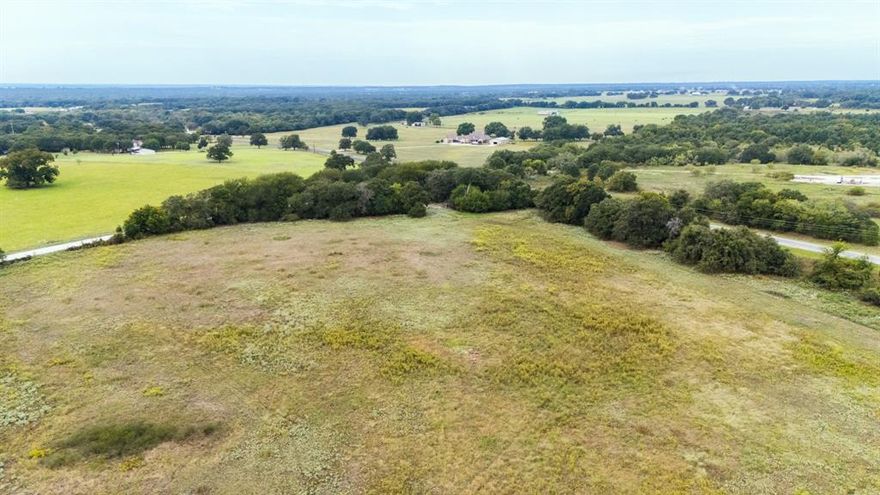 Step into a rare opportunity to own 12.52 acres of prime Texas land that’s anything but ordinary. This corner lot is a canvas of coastal grass stretching wide under open skies, framed by mature trees that offer just the right touch of natural privacy without sacrificing panoramic views.
Whether you're dreaming of a private ranch, a weekend retreat, or a long-term investment, this land delivers. The setting is serene, the space is generous, and the potential is limitless. With room to roam, build, graze, or grow—this property invites you to think big and live boldly.
Your slice of the Texas countryside is waiting. Come walk it, feel it, and imagine what you’ll create.