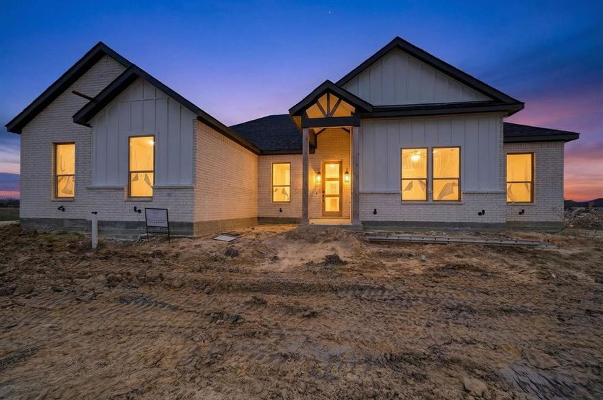 Welcome to this stunning New Build 4-bedroom, 3 full bathroom single-story custom home nestled in the peaceful community of Lone Oak, Texas. Perfectly blending country charm with modern comfort, this beautiful home offers the ideal setting for families seeking space, style, and serenity. Step inside to discover an inviting open-concept layout with generous living areas, high ceilings, and abundant natural light throughout. The spacious living room features a cozy fireplace that flows seamlessly into the dining area and chef’s kitchen, completed with quartz counters and a center island, stainless steel appliances, and ample cabinet space with upper showcase cabinets—perfect for everyday living and entertaining. Designed for modern living, the home features a dedicated private office ideal for remote work. The private primary suite is a true retreat, offering a spacious bedroom, a spa-like en-suite bath with dual vanities, a soaking tub, a separate walk-in shower, and a large walk-in closet. Three additional bedrooms are generously sized and share a full hall bath. This home also includes a dedicated laundry room, two-car garage, and thoughtful finishes throughout, including stylish flooring, neutral color palettes, and energy-efficient systems. Enjoy peaceful Texas evenings in the large backyard with a covered patio with a ceiling fan. Situated on a half-acre lot in a newly developing neighborhood with easy access to local schools and I-30 for a quick commute to Greenville, Rockwall, and the DFW Metroplex. Whether you’re upsizing or settling down, this move-in-ready gem offers the perfect blend of rural tranquility and modern amenities.  The property faces a tranquil pond, offering picturesque water views! Don't miss your chance to own a piece of Lone Oak charm. Schedule your private showing today!