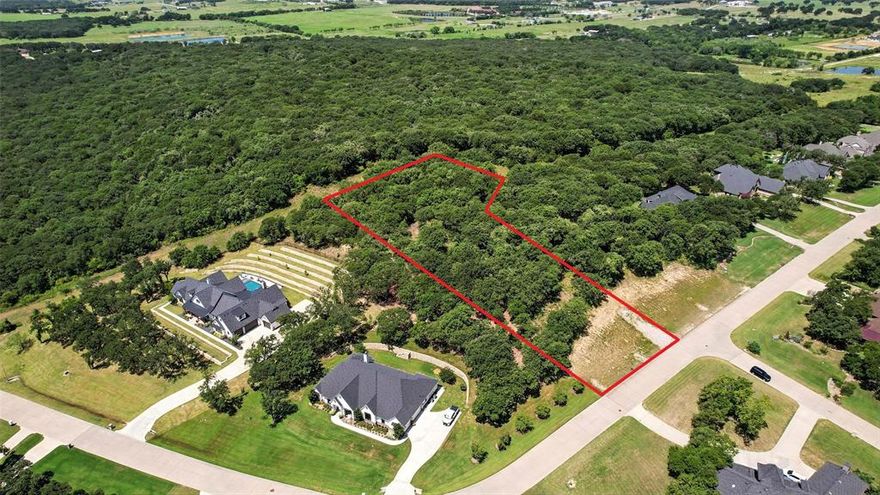 Build your dream home on this 1.129-acre lot in an upscale, subdivision spanning over 153 acres. This community is perfectly tucked away in a quiet, rural setting with native trees, rolling hills, and high elevation that captures beautiful views. Enjoy over 25 acres of scenic greenbelt featuring walking trails, a serene pond with a flowing fountain, and winding concrete streets that blend naturally with the landscape.

Bring your own builder and create a custom home that fits your vision! The neighborhood offers the convenience of Burleson city sewer and Johnson County water, and is located within Joshua ISD (buyer to verify schools and taxes). Don’t miss this rare opportunity to own a spacious lot in a peaceful yet upscale community with the perfect balance of nature and modern amenities.