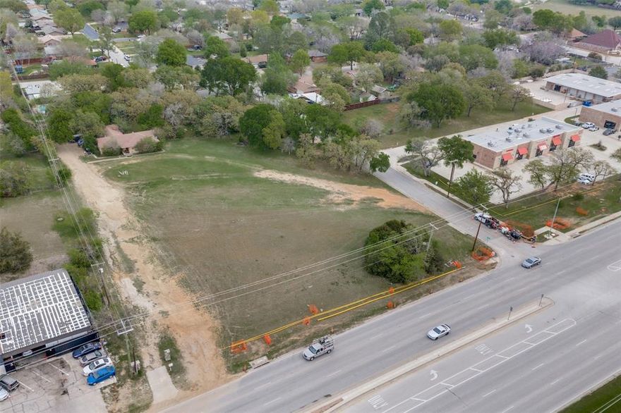 Positioned in the heart of the DFW Metroplex, this exceptional 2.4-acre tract offers a rare opportunity to secure prime land in an established and highly accessible location. Surrounded by mature neighborhoods and ongoing growth, this property presents unmatched flexibility for a variety of development opportunities—whether you're envisioning a custom residential project, small-scale development, or a strategic long-term investment. Located within the highly regarded Hurst-Euless-Bedford (HEB) ISD, the property benefits from strong school appeal—an important driver for both end-users and future resale value. Its central location provides quick access to major highways including TX-183, SH 121, and Loop 820, placing you minutes from both Dallas and Fort Worth, DFW International Airport, and a wide range of shopping, dining, and employment hubs. With 2.4 acres of raw land, the canvas is wide open. The flat, usable terrain allows for flexible site planning and efficient development, while the surrounding area supports a range of potential uses. Opportunities like this—combining location, school district strength, and land versatility—are increasingly hard to find in the Mid-Cities. Bring your vision and capitalize on one of Hurst’s most compelling land opportunities.