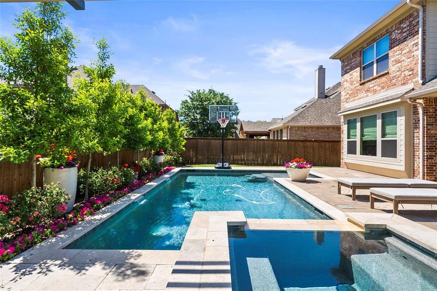 This beautifully updated home offers a 2-story foyer, a striking curved wall, and uninterrupted views to a resort-style backyard with a gunite pool, spa, outdoor kitchen, and multiple spaces to relax, dine, and entertain with ease.
Discover this exceptional 5-bedroom luxury home in McKinney zoned to Lois Lindsey Elementary School a 10 with offering a Gifted & Talented program.  A grand two-story foyer welcomes you inside, where a custom curved architectural wall and open layout create seamless sight lines to the stunning backyard retreat. The home has been thoughtfully updated with fresh interior paint, a redesigned staircase featuring hardwood and modern railing, and new carpet in the primary suite and downstairs guest room. The downstairs bathroom has been fully refreshed with updated flooring, sink, and shower, while the utility room also features new designer flooring. Upstairs you will find 3 bedrooms with 2 en suites! Additional bonus space gives upstairs guests a place to relax and unwind. 
Custom storage upgrades enhance both form and function, including built-out closets in the primary bedroom and a custom pantry in the kitchen. The garage stands out with epoxy flooring and added upper shelving. Step outside to experience the true highlight of the home: a private outdoor oasis with a large Gunite pool and spa, outdoor cooking area, covered deck for dining, and a cozy fire pit, offering the perfect setting to unwind and enjoy peaceful evenings in McKinney.