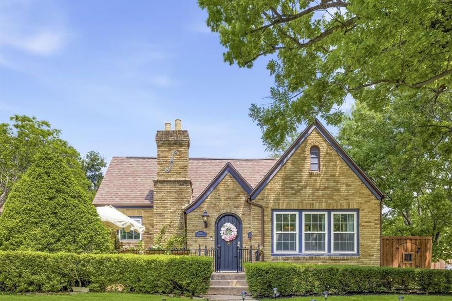 Charming Tudor-style home located in prestigious Historic Greenland Hills, where timeless architecture and thoughtful modern updates come together in one of Dallas’ most beloved neighborhoods. Beautiful refinished hardwood floors, classic archways, crystal door knobs, and abundant natural light preserve the character of the home, while extensive renovations add comfort, style, and functionality throughout.

The inviting living room centers around a decorative gas fireplace and flows seamlessly into the dining area, creating the perfect setting for entertaining or everyday living. A beautifully remodeled kitchen features custom cabinetry, granite countertops, stainless KitchenAid appliances including a gas range and built-in refrigerator, plus smart storage solutions throughout. The attached mudroom and office addition adds flexibility and convenience rarely found in homes of this era. Offering 3 bedrooms, 2 full baths, and 1 half bath, the home blends historic charm with elevated finishes. One secondary bedroom functions beautifully as a home office with French doors and a walk-in closet. The spacious primary suite features an updated bath with a clawfoot soaking tub, separate shower, generous storage, and a large walk-in closet.

Outside, the property offers the rare advantage of both a front yard and side yard, with refreshed landscaping, added flower beds, star jasmine vines, rock-lined fencing, and a leveled turfed side yard designed for low-maintenance outdoor living. Recent improvements throughout the home include refinished and restained hardwoods, smooth Level 5 walls with added insulation, updated designer lighting from Crate & Barrel, refreshed paint, updated trim work, new plumbing beneath the home, insulated garage walls, a fully loaded Ring security system, and the latest Nest thermostat. A rare opportunity to own a move-in ready Tudor in the heart of Greenland Hills with the perfect balance of historic charm and modern living.