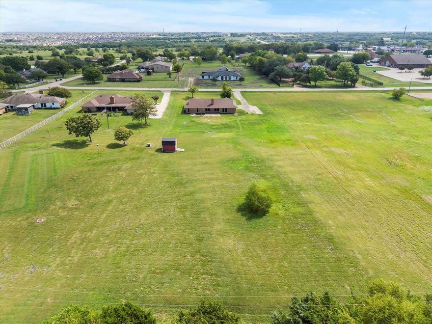 **LARGE LOT with UPDATED HOME ROCKWALL** Welcome to this stunning brick home nestled on over 1.25 acres in one of Rockwall’s most desirable and secluded areas. With just over 1,800 square feet of thoughtfully designed living space, this residence blends modern updates with timeless charm and custom touches throughout.

Step inside to find luxury engineered wood flooring flowing seamlessly through every room, creating a cohesive and elegant look. The newly renovated kitchen is a showstopper, featuring updated cabinetry, sleek countertops, and modern fixtures—perfect for both everyday living and entertaining.

This home also boasts major upgrades including a brand-new roof, new siding, and a new HVAC system—providing peace of mind and energy efficiency for years to come.

Enjoy the serenity of a private, oversized lot while still being just minutes from shopping, dining, and easy access to I-30. Whether you're relaxing on the patio or planning your next backyard project, there’s plenty of space to spread out and make it your own.

Don’t miss your opportunity to own a move-in ready home with land, privacy, and style—all in the heart of Rockwall.