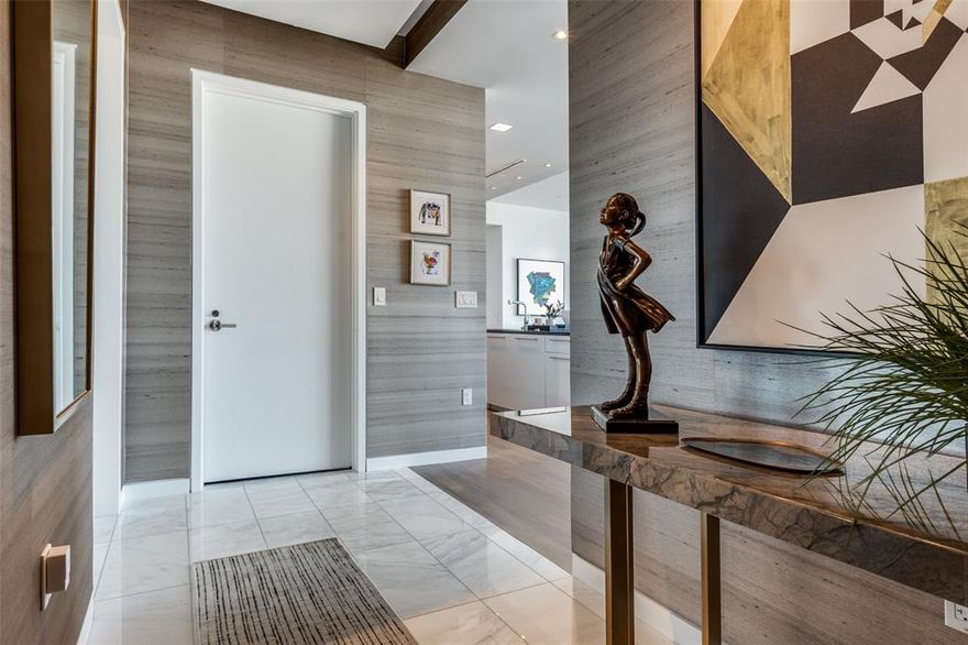 Freshly completed designer high end finishes throughout this jewel box home. A private elevator ride delivers you into a warm and inviting landing wrapped in custom wallpaper. This two bedroom home boasts upgraded lacquer cabinetry with rich basalt countertops, custom wall coverings, a fresh contemporary built in mirrored bar with floating shelves, abundant and substantial storage and closets. Gorgeous contemporary lighting. Upgraded carpets, fresh hardwoods and paint. The integrated utility room is not to be missed.  Miele appliances, marble baths, private terrace, pool, spa, fitness center, guest suites and private dog park.  Beautifully appointed details. Exceptional service is what our residents experience every day.