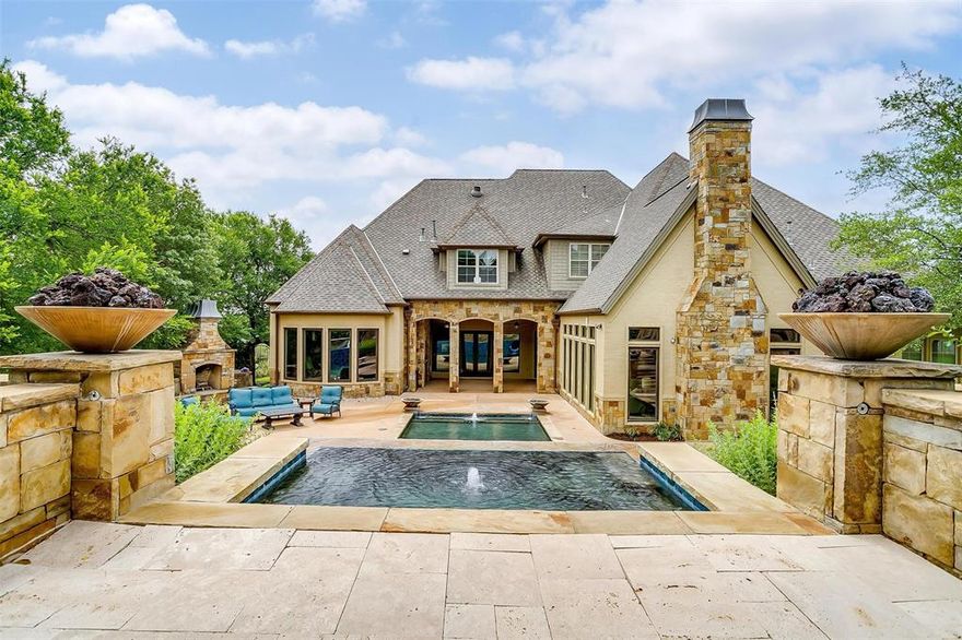 This truly exceptional estate, nestled on a hilltop cul-de-sac lot within the beautiful gated Stone Creek Farms neighborhood, presents a rare ownership opportunity. Enjoy breathtaking panoramic views of Aledo's picturesque countryside from this exclusive property, which also offers convenient access to I-20. Upon entering, you will immediately appreciate the inherent elegance showcased by features such as hand-scraped hardwood floors, a private study ideal for working from home, and a dramatic staircase serving as a stunning focal point. The open floor plan has been thoughtfully designed for both entertaining guests and comfortable family living. The heart of this home is the dream kitchen, which includes a magnificent LaCanche stove, handmade in France, demonstrating the level of detail and luxury present throughout. Also featured is a well-appointed butler's area with glass front cabinets and a built-in refrigerator, along with a large, functional island. The kitchen flows seamlessly into the formal dining and living rooms, where a wall of newer windows provides an abundance of natural light and overlooks a peaceful outdoor living space reminiscent of your favorite resort. This luxurious home continues to impress, offering other highly desirable features, including a dedicated workout room, a media room perfect for movie nights, and a fantastic game room complete with a wet bar and balcony. Stepping outside, you'll discover a multi-level pool with an inviting hot tub, captivating water features that add to the serene ambiance, and even a fun tunnel slide. The outdoor space also includes a cozy wood-burning fireplace, a huge side lawn offering endless possibilities for recreation, and the convenience of multiple garages. For added peace of mind, the roof was replaced in 2020. We have compiled a comprehensive full feature and update document that provides even more detail about this remarkable property.  It is available upon request.