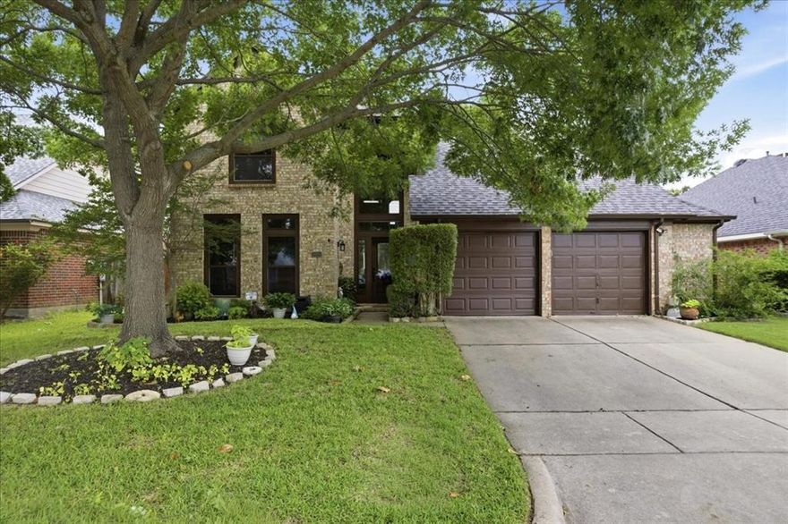 Located in the desirable Hulen Bend neighborhood, 6801 Briarwood offers a thoughtful layout, generous living spaces, and timeless features designed for comfortable everyday living. The spacious primary suite is conveniently located downstairs and features tall ceilings, a relaxing jetted tub, separate shower, and double vanity. Rich hardwood floors flow through the formal living and dining areas as well as the family room, while ceramic tile flooring adds durability and style to the kitchen and baths. The inviting family room centers around a cozy gas log fireplace and opens to the kitchen, complete with an electric glass cooktop, stainless steel oven, walk-in pantry, and abundant workspace. Chair rail molding adds classic character to the formal dining room. Upstairs, an oversized loft provides the flexibility for a game room, media space, or home office and includes a large storage closet, perfect for holiday decorations or luggage. Three secondary bedrooms and a full bath are located upstairs, including one bedroom with a walk-in closet. Ceiling fans in every bedroom and a shelved linen closet upstairs add convenience and functionality. Plush carpet upstairs creates a warm and comfortable retreat. Additional highlights include a dedicated mudroom, laundry room with built-in cabinets, landscaped front and back yards, and a covered flagstone patio perfect for outdoor entertaining or relaxing evenings at home. Combining space, storage, and versatile living areas, this Hulen Bend home is ready to fit a variety of lifestyles.