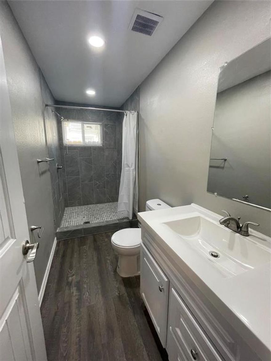 2 Bedroom 1 Bath Duplex open floor plan. conveniently located near love field airport. washer and dryer. private gated parking.