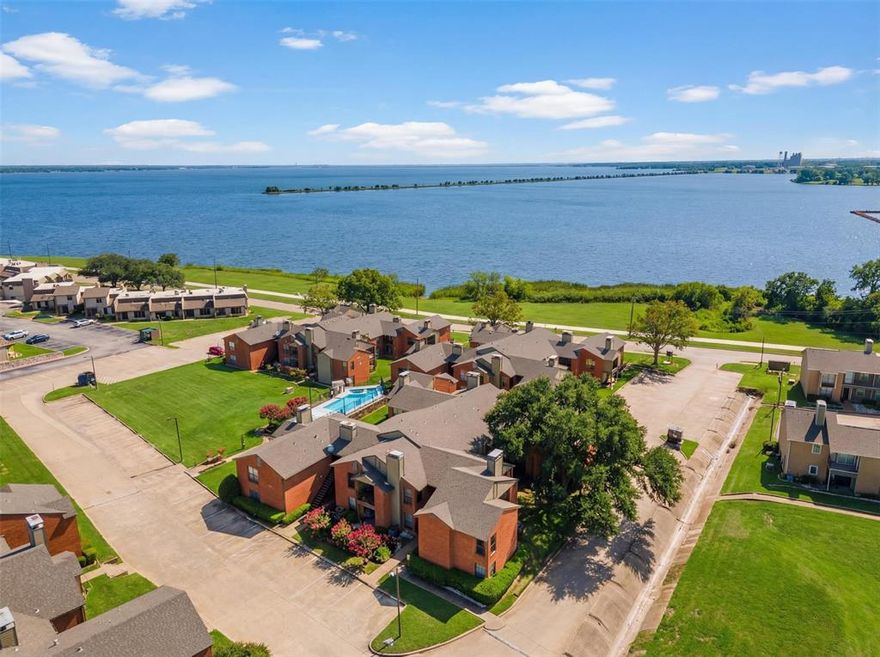 Went Under Contract after only 5 days on market- Back on market due to Buyer unable to obtain financing! 
Welcome to this beautifully situated upper-level condo offering the perfect blend of comfort, convenience, and lifestyle. Just steps away from Lake Ray Hubbard, this residence presents an excellent opportunity for homeowners and investors alike. Whether you’re seeking a primary residence, second home, or income-producing property, this unit delivers exceptional versatility. 
The interior features a bright, open layout enhanced by soaring ceilings and abundant natural light from oversized windows. A functional kitchen opens seamlessly to the main living space, creating an ideal setting for both daily living and entertaining. A charming fireplace and built-in wet bar add character and warmth, while the covered balcony extends your living space outdoors for quiet mornings or evening relaxation. The generously sized bedroom offers a private retreat with a spacious walk-in closet and a well-appointed en-suite bath featuring dual vanities, soaking tub, and separate shower. Additional storage throughout the unit adds everyday practicality. 
Residents enjoy a low-maintenance lifestyle with HOA services covering exterior care, landscaping, and trash, along with access to a refreshing community pool and spa. Notable upgrades include an updated HVAC system (approx. 2018) and a new roof in 2024. Located within the highly regarded Garland Independent School District and near Mesquite Golf Course, local parks, and major commuter routes, this inviting condo offers outstanding value in a prime location.