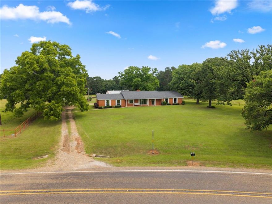 400± Acre East Texas Ranch - Two Homes, 5 Ponds, Pool & More Step into a legacy of East Texas ranching with this remarkable 400±acre property, just 4 minutes from I-30 between Mt. Pleasant and New Boston. Operating as a working cattle ranch since the early 1900s, this land has been thoughtfully maintained and improved over generations — and it's ready for yours. Property Highlights: - 400 acres of fenced and cross-fenced land, ideal for cattle, horses, or recreation - The Original Ranch Home: 3 bed, 2 bath with neutral interiors, granite countertops, panoramic views, and a private pool - Second Home across the FM road — can serve as multi-generational living, rental income, ranch hand home for on-site staff or extra guest accommodations - 5 ponds, private creek, and two wells plus city water access - 100+ year old pecan trees, large garden, and mature hardwoods throughout - 75 acres of pine ready for thinning and export-quality rock on-site for added revenue potential - Export-quality rock located on property for potential income - Two large shops: 24x40and 40x80, perfect for equipment, vehicles, or projects With over a century of cattle production, this ranch combines rich history with endless possibilities — all in a peaceful setting with easy access to schools, shopping, and highways. Land long sought-after for generations and now finally available for purchase, this is your chance to own a true East Texas treasure. Schedule your private tour today.