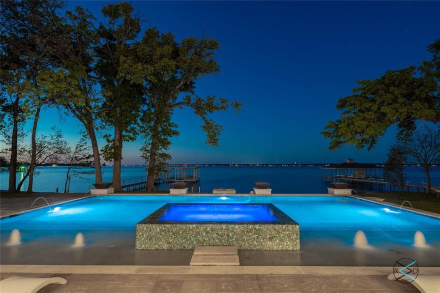 Fabulous two-acre waterfront estate on wide open water in the prestigious Brentwood Estates. Featuring approximately 200 feet of shoreline, this exceptional property offers unobstructed lake views, mature trees, and a rare sense of privacy and seclusion. The residence showcases two expansive living areas with soaring ceilings, floor-to-ceiling windows, and three fireplaces that create a warm yet sophisticated ambiance. The custom gourmet kitchen is designed for entertaining, complete with top-of-the-line appliances, gas cooking, and a lakeside dining area with breathtaking views. The home offers five bedrooms, six bathrooms, has been recently updated, and includes a versatile flex room ideal for a media room, office, or fitness space. Outdoor living is equally impressive with a sparkling pool and spa, outdoor kitchen, and generous entertaining areas. A large double boat dock with a sun deck completes this extraordinary lakefront estate- truly resort-style living on Cedar Creek Lake.