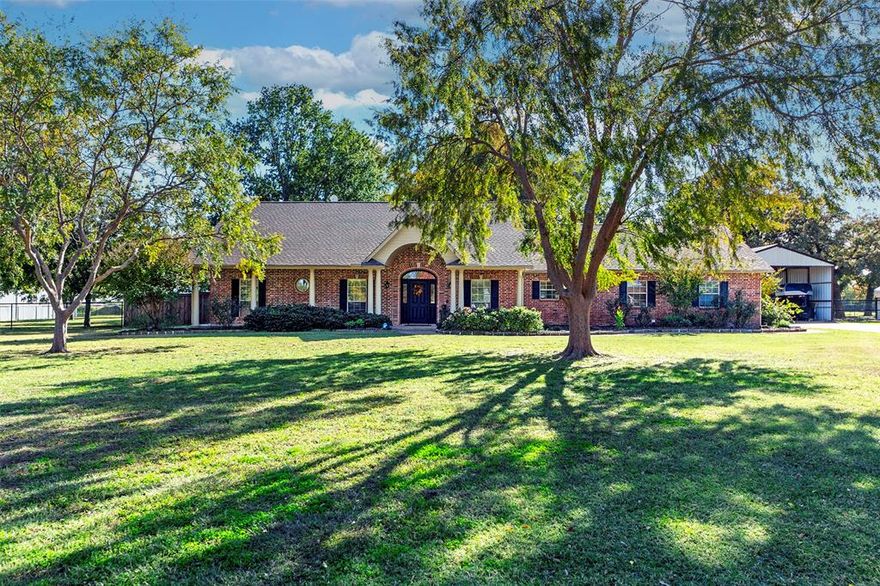 Located on 3 scenic acres in the desirable Running Springs acreage neighborhood between Pilot Point and Aubrey, this well-maintained single-story custom home offers privacy, functionality, and room for horses. Positioned at the back of the neighborhood, the home provides approximately 2,260sf of interior living space, 3 bedrooms, a spacious living area centered around a brick gas fireplace, and a dedicated home office. The kitchen features granite countertops, stainless appliances, double ovens, and an open connection to the dinette. The primary suite includes an adjoining flex room that is ideal as a private sitting area, dressing room, or expanded closet space. Wood floors extend through the foyer, living areas, office, kitchen, and dining space, with tile in both bathrooms and the oversized utility room. The home was wonderfully updated in 2020, including the kitchen and baths, paint, flooring, countertops, and appliances.  The attached two-car garage includes a walk-in storm shelter and a door to the fenced backyard.   A covered back patio, accessible from the main living space, opens to a nice gazebo, which leads to a flagstone patio with a fire pit, all under a canopy of mature shade trees that create a comfortable outdoor setting.  The property is set up for horses with pipe and no-climb pasture fencing, a loafing shed, & sandy loam soil.  Additional improvements include a 24 x 30 covered outbuilding suitable for boat or RV storage, and a 40 x 52 classic lofted wood barn with decades of character, updated with attractive metal siding, and two horse stalls with direct access to the pasture.  Running Springs in Pilot Point is an established, single-access neighborhood of homes on acreage. Just minutes from Lake Ray Roberts, residents can enjoy quick access to boating, fishing, equestrian & hiking trails. With its country setting, the location offers good access to Denton, Frisco, the Dallas North Tollway, & business, dining, & retail hubs across North DFW.