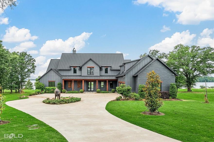 Luxury Lakefront Living 
Located on the North Shore of Cross Lake in the gated community of The Point of Cross Lake. This stunning 2022 Hamilton Builders home offers 5,709 sq ft of refined lakefront living. Featuring 4 bedrooms, 3 full baths, and 3 half baths, every detail is thoughtfully designed with Restoration Hardware-inspired interiors and wide plank wood flooring throughout.
Enjoy breathtaking sunsets and views from your private outdoor oasis complete with an in-ground pool, motorized patio shades, and a fully equipped outdoor kitchen with Green Egg, EVO grill, and more. The interior boasts a chefs kitchen with WOLF appliances, custom island, walk-in pantry, and butlers pantry.
This smart home is powered by a Control4 system to manage lighting, HVAC, security, and more. Folding panel doors seamlessly connect the living space to the outdoors. Additional highlights include a dog wash station, second-floor living area with bar, flex space for a theater or golf simulator, and a bonus room.
Do not miss this rare opportunity to own lakefront luxury with every modern comfort.