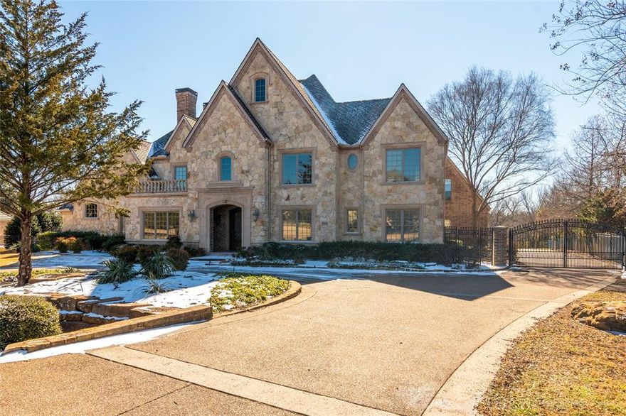 Fall in love as you peer over your balcony and see the beautiful ponds and walking trails accessible from your own walk-thru gate. Perfect any time of the year; especially fall as leaves cover the entire path. Gated neighborhood is quiet, serene and Carroll ISD or Westlake Academy approved. The entry is dramatic as your eyes follow the quality workmanship of wood moldings, stone, leaded glass, barrel and coffered ceilings plus elaborate iron railing leading upstairs and to all balconies. Step into the family room where the outdoor pours in through the wall of butted glass.   Large Chef's kitchen offers Viking appliances including a huge gas cooktop. All bedrooms have ensuite baths and walk-in closets. Must see!