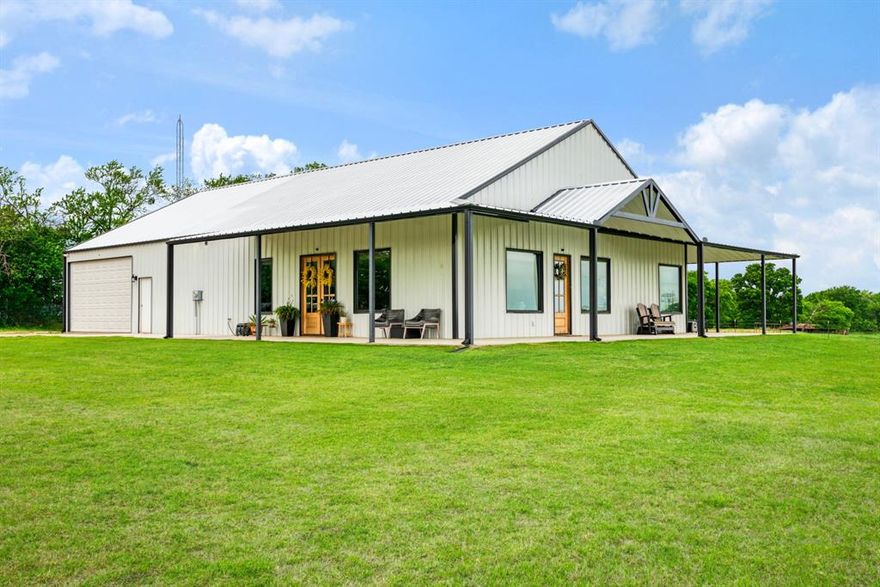 Discover the perfect blend of country living and modern comfort in this stunning barndominium-style home situated on close to 30 picturesque acres in the highly sought-after Chisum ISD. Thoughtfully designed for both everyday living and entertaining, this 2 bedroom, 2-bath home offers an open-concept and handicap friendly layout with durable concrete flooring and a spacious living area filled with natural light.

Featuring a stunning kitchen, complete with an oversized island, granite countertops, and custom cabinetry that provides both beauty and functionality. The gas cooktop, built in ovens and walk in large walk in pantry are a chef's dream! Designed to be handicap friendly, this home also includes 36-inch doorways with solid wood doors and beautiful stained concrete floors throughout. The private primary suite is oversized and a true retreat.  The en suite bath is complete with a luxurious soaking tub, walk-in shower, dual sinks, custom cabinetry, large walk in closet and ample space to relax and unwind. The impressive 30 x 40 sq ft attached garage, offers plenty of room for an RV, boat, or multiple vehicles; perfect for hobbyists, storage, or workspace needs. The home is also equipped with foam insulation for energy efficiency and built in dehumidifier. Step outside and experience everything this exceptional property has to offer. The land is fenced and cross-fenced into three sections, making it ideal for livestock or agricultural use. The front pasture is equipped with water access, and the property includes two ponds, enhancing both function and scenic appeal. Additional improvements include a 25x60 four-stall shed with power and lighting, a 25x30 two-stall shed located in the pasture, and a small fenced dog area conveniently located just off the mud room. The pasture and yard are routinely sprayed and well maintained, reflecting pride of ownership throughout.  Additional property on the southeast corner is also available, see MLS #21241780