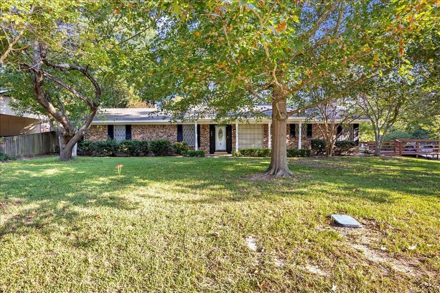Beautifully remodeled home in the heart of Lindale, TX. Situated on a corner lot with mature trees, shaded yard and deck to enjoy the view. Inside you'll be pleased with everything brand new! Luxury vinyl plank, carpet, cabinets, countertops, paint, light fixtures, fans, stainless steel stove, dishwasher, microwave and refrigerator, and more! There are 2 living areas, wood burning fireplace, kitchenette and countertop seating. 3 bedrooms and 2 baths. Carport and storage building. New roof in 2024. Move in ready!