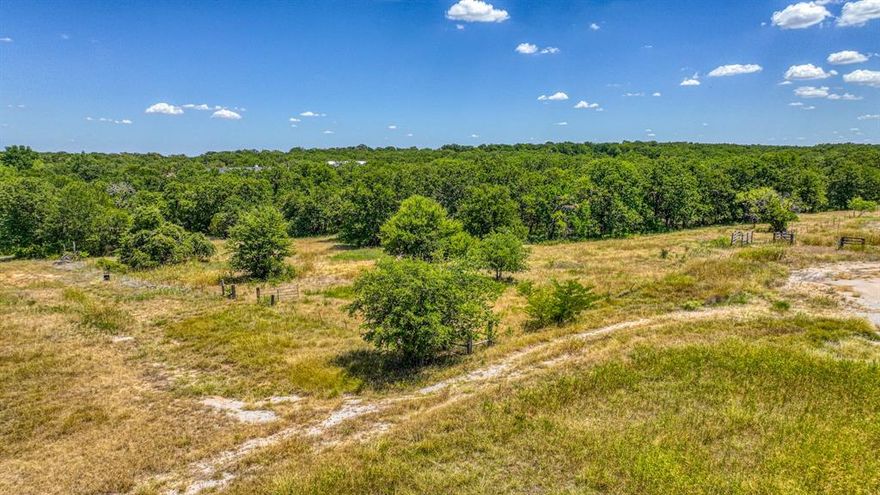 8+ Acres in Paradise, TX**

Discover your personal oasis on over 8 acres of prime land in beautiful Paradise, Texas! This property features a perfect blend of wide open spaces and heavily wooded areas, offering versatility for whatever your needs may be. Enjoy the benefits of no city taxes and buyer-friendly restrictions, making this the ideal spot for your dream home. With a low minimum build size of just 1200 sqft, you can create the perfect retreat, and temporary living is allowed while you plan your future.

This property is perfect for multi-generational living, as a guest house or second mother-in-law home is permitted. Plus, you'll benefit from the highly-rated Paradise ISD schools, ensuring quality education for future generations, all within the charm of small-town life.

Embrace the outdoors with ample space to build a metal shop and enjoy your recreational toys. With no time limit to start construction, you can buy now and build later at your convenience. Escape the hustle and bustle of the city while remaining less than an hour from DFW and just 20 minutes from the amenities of Springtown or Decatur.

Need assistance finding the right builder? We're here to help you every step of the way. Secure your slice of rural paradise today before it’s gone! Txt keyword LOTS14 to 88000 for current inventory.
