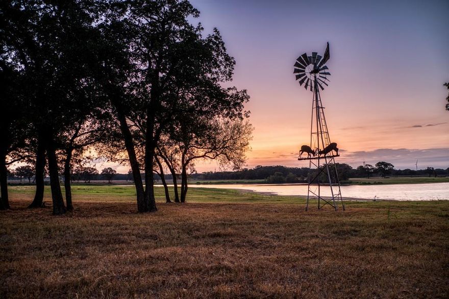 A pristine 148 Acre ranch just 25 minutes from Waco. This is a highly improved ranch where you can experience your own private 25 Acre lake stocked with trophy bass, custom barndominium, producing pastures, mature hardwoods, and excellent hunting. 
BRAND NEW insulated garage doors, additional 14' x 76' concrete slab for parking or addible shop space, and freshly planted trees with landscaping. Newer immaculate 40’ x 80’ heated and cooled barndominium holds private living quarters of around 1,600sqft of living space and includes 1-bedroom, full kitchen with propane range, 1-bathroom, walk-in pantry, and cozy living room. The rest of the barndominium is fantastic for endless toys and the perfect setup for entertaining guests, featuring a stone outdoor fireplace and exceptional views of the lake. The large overhangs spanning 40’x 70’ offer excellent cover along with 4 large 12’ tall bay doors. Attached to the barndominium is a 40’ x 60’ shop that is also heated and cooled. In the shop comes an Atlas car lift, and ample outlets for various machines and equipment. Both the barndominium and shop have been professionally spray foamed and the concrete floors stained. 
 Land-Topography: Currently used for hay production, the pastures are routinely sprayed for weeds and supplemented with fertilizer. Multiple mature oaks and pecan trees dot the landscape throughout with large groups towards the rear of the ranch where a wet weather creek meanders through. Additional tank in place that is stocked. 
Utilities: Two water meters and electricity is in place and partially underground. The septic system is a large capacity unit, designed for any additional housing along with a newly installed propane tank. 
Other Improvements: On the property is a metal pavilion right by the lake that is another great spot for cleaning the days catch or entertaining guests. Another 25’x 50’ metal pavilion is in place for equipment storage with electricity and water supplied to it.