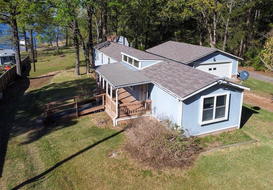 Waterfront Opportunity on Lake Palestine - East Texas
Enjoy quiet, peaceful living on Lake Palestine. This unique property offers endless potential, featuring two waterfront lots in the desirable Waterwood Subdivision.  The property includes and older manufactured home that is in need of repair and updating including new sub flooring . Perfect for those looking to renovate or start fresh. A detached oversized two-car garage and a large workshop with electricity provides plenty of space for storage, hobbies or projects.  The front lot offers an excellent homesite for building a new residence with scenic lake views.  Extending the dock approximately 20-30 feet into the lake would improve the water depth and usability.  Waterwood subdivision features county-maintained roads and low HOA dues of $36 per lot annually.  Conveniently located 7 miles from Chandler and only and additional 20 miles to Tyler giving you easy access to shopping , dining and medical facilities.  If you are looking for affordable waterfront property with room to customize, this is a rare opportunity in East Texas.