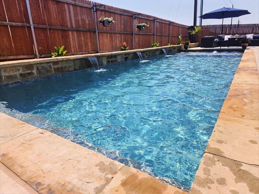 Motivated Seller. Price Reduced. Offering 5k towards closing. Welcome to 120 Wagon Mound Drive, a beautifully maintained home in the Settlers Glen neighborhood in Waxahachie, TX. Built in 2020, this single-story brick home offers three bedrooms, two full bathrooms, a dedicated home office, and a pool. Step outside to your personal backyard oasis, featuring a custom gunite saltwater pool built in October 2022. Surrounded by a spacious patio and with no rear neighbors, this is the perfect spot to relax or entertain. Enjoy open-concept living with a spacious family room that flows seamlessly into the kitchen and dining areas. The gourmet kitchen features granite countertops, a large center island, stainless steel appliances, a butler's pantry or coffee bar, and a walk-in pantry ideal for both entertaining and everyday use. The private master suite offers a relaxing retreat, complete with a dual vanity, garden tub, separate shower, and a walk-in closet. Two additional bedrooms and a full bathroom are thoughtfully placed on the opposite side of the home for privacy. Additional highlights include wood-look ceramic tile flooring in main areas, an office nook, a built-in mud bench, smart home wiring, a security system, a full sprinkler system, a laundry room with space for a fridge-freezer, and a custom epoxy-coated garage floor with custom cabinets. Don't miss this move-in-ready gem with a resort-style backyard. Schedule a showing today