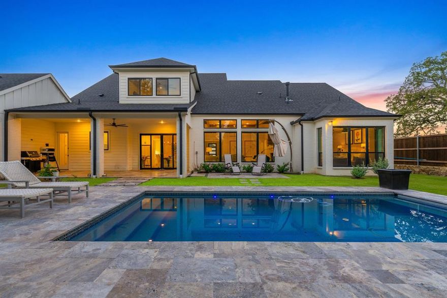 This stunning Adams custom home is situated on an expansive corner lot in the desirable Country Club Estates with no HOA. The property offers four spacious en-suite bedrooms. The primary bedroom features a deep soaking tub, dual walk-in closets, and a walk-in shower. The kitchen boasts quartz countertops, designer light fixtures, a gas cooktop, double ovens, and an oversized pantry. The kitchen flows seamlessly into the breakfast and living room. The living room showcases stunning wood beams and is centered around a timeless fireplace. The breakfast area opens up to a covered patio featuring travertine pavers and leads to a newly installed Gohlke ozone pool with an automatic cover. Beautiful landscaping has been added for privacy. For family or holiday gatherings, there is a stunning formal dining room flanked by a staircase and a welcoming foyer. Down the hall, there is a library and a second living area downstairs, as well as a spacious laundry room and a butler's pantry. Upstairs offers two bedrooms and a game room. Nail-down hardwood floors run throughout the home. The property also includes high-efficiency AC, foam insulation, an Insta hot tankless water heater, a covered front porch, an expansive back patio overlooking the pool with an automatic cover, and a three-car garage. Located in the desirable Denton ISD.