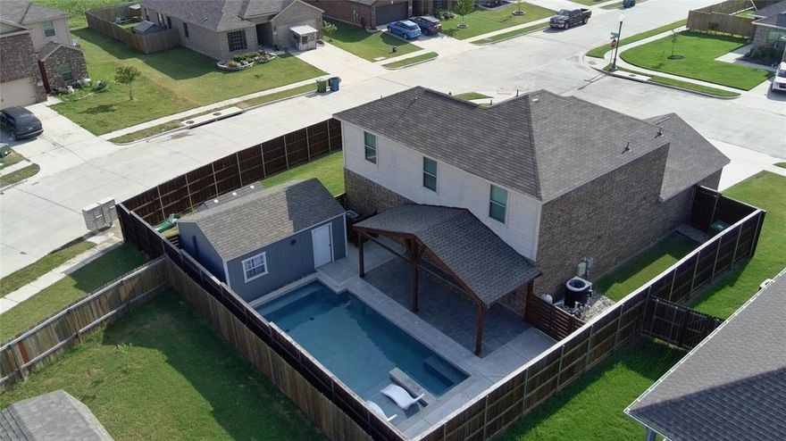 Here is the corner lot home with a pool you have been waiting for!  Brand New Roof November 2025.  Plenty of room for everyone with 4 large bedrooms, 2.5 bathrooms, 2 car garage built for entertaining.  Inside, spare bedrooms are upstairs away from the primary suite with a huge 8x10 walk in closet.  Kitchen features granite counters, a pantry, and lots of storage!  Fresh paint throughout.  Outside is your very own resort oasis!  Custom pool built in 2024 with a heat pump that warms and cools the water for year round use and enjoyment!  Upgraded 8ft privacy fence with steel posts with plenty of grass for the pups too!  Custom covered patio perfect for morning coffee and summertime BBQ and pool parties!  14x20 shop features electric service, insulation, and a mini split AC.   Come see this one today!