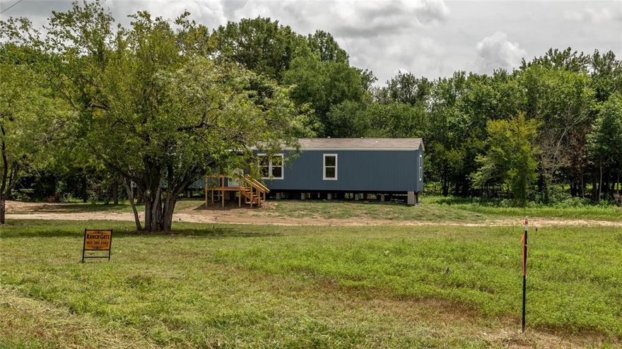 CEDAR D LOT 16 WITH A HOUSE at LAKE MEXIA is a Lake front lot that is 647.79 ft across the front and 142.35 ft across the back, per survey, with a BRAND NEW 16 x 60, 940 sq ft, 3 Bed 2 Bath MANUFACTURED HOME! Manufactured in Waco, TX, this beautiful home is all electric and includes a dishwasher, stove and oven range, vent-a-hood and Whirlpool fridge. WD hookups, covered front and back porches and decks. Open floor plan, hardwood cabinet doors, 2 inch miniblinds throughout, Lino floors, Low E Thermal Pane Windows, AND your backyard is a cove at Lake Mexia! Lake Mexia is located on the Navasota River, seven miles west of the City of Mexia and covers approximately 1140 Ac. Primary fish for the lake are lg mouth bass, white bass, crappie, channel and blue catfish. Recreational opportunities include camping, swimming, boating and fishing, with Fort Parker State Park also located just ten minutes away. Your new lake house awaits you!