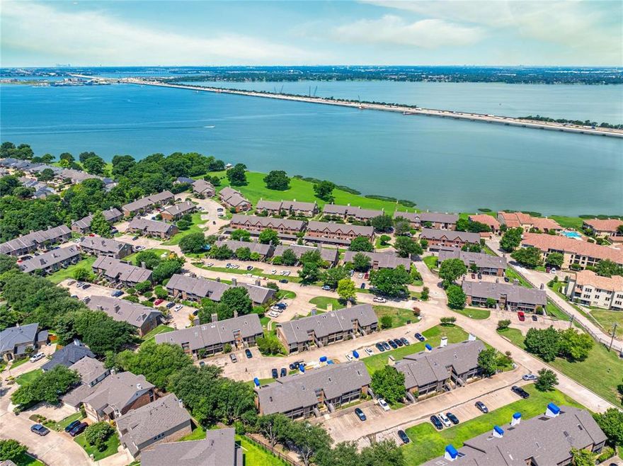 Welcome to Effortless Rockwall Living!

Location: Just steps from The Harbor District and minutes from I-30!

This beautifully maintained, move-in ready condominium features thoughtful updates throughout, including a new roof installed in 2025.

Interior Features:

Bright, open-concept living area with vaulted ceilings, skylights, and a mosaic-tile fireplace.

Updated kitchen with granite countertops, expanded cabinetry, and a comfortable eat-in bar.

Abundant storage: dedicated pantry, separate utility room, under-stairs storage, upstairs storage options, and exterior storage closet.

Primary Suite & Additional Rooms:

Main-level primary suite with dual sinks, oversized walk-in shower, generous closet space, and access to a private patio.

Flexible second bedroom ideal as an office, nursery, workout room, or additional living space.

Upstairs offers a second updated primary suite and a large loft with built-in bookshelves, perfect for a game room, media space, or library.

Outdoor & Community Amenities:

Panoramic views from front and back balconies, overlooking community and pools.

Gated community with four sparkling pools (one conveniently just outside your back door), clubhouse, and lush green spaces.

Location Highlights:

Minutes from The Harbor, dining, shopping, and Lake Ray Hubbard.

Modern updates, incredible amenities, and an unbeatable Rockwall location.

Don’t miss this rare opportunity—schedule your showing today!