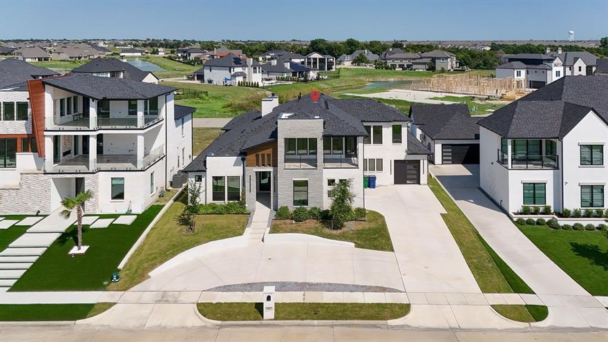 Luxury Lakeview Living in Heath Golf & Yacht Club! 4 Beds, 5 Baths, 4,435 Sq Ft  Built 2022  0.26 Acres  3-Car Garage
Welcome to this stunning Whittle & Johnson custom built lakeview home, ideally situated in the prestigious Heath Golf & Yacht Club community. With breathtaking views of Lake Ray Hubbard, this move-in-ready residence blends luxury, functionality, and exceptional design across 4,435 square feet of elegant living space.
Inside, you'll find 4 spacious bedrooms and 5 bathrooms, including two main-floor master suites, each with spa-inspired en-suite baths. The first floor features 3 bedrooms and 3.1 full baths, while the second floor offers an additional living area with a 4th bedroom, full bath, and gorgeous water views perfect for guests or multi-generational living.
The open-concept layout showcases a gourmet kitchen with a statement waterfall island, gas stove, double ovens, and upscale finishes throughout. The expansive primary suite includes a luxurious bath with soaking tub, oversized shower, and a custom walk-in closet.
Enjoy seamless indoor-outdoor living with a built-in outdoor BBQ ideal for entertaining or relaxing evenings as the sun sets over the lake. The 3-car garage provides ample space for vehicles and storage.
Set on a 0.26 acre lot, this home is part of a premier lakeside golf community offering world-class amenities: Private marina, Resort-style pool, Clubhouse with dining, Tennis & pickleball courts, Scenic walking trails, Championship golf course.
Located in a top rated school district, this rare offering combines upscale living, water views, and a vibrant community lifestyle.
Don’t miss this exceptional opportunity to own one of Heath’s finest lakeview homes!
