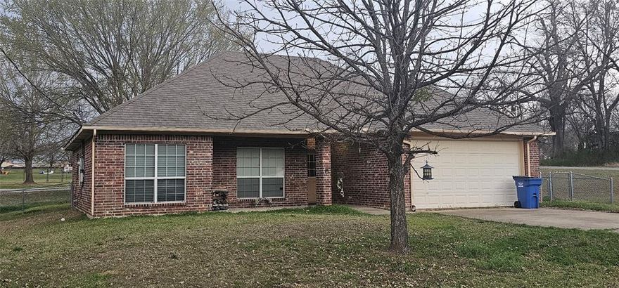 Charming 3-bedroom, 2-bath brick home located in the heart of Grand Saline. Built in 2005, this well-maintained home offers approximately 1,337 square feet of comfortable living space with a functional layout perfect for families, first-time buyers, or anyone looking to enjoy small-town living.
Step inside to a welcoming living area featuring a cozy fireplace and plenty of natural light. The kitchen is equipped with essential appliances and offers ample cabinet space for everyday cooking and entertaining. The primary bedroom includes a private ensuite bath, while two additional bedrooms provide flexibility for guests, a home office, or growing families.
Outside, you'll find a manageable lot with room to relax or garden, along with an attached garage for convenient parking and storage. Located in an established neighborhood just minutes from schools, shopping, and downtown Grand Saline, this property offers the perfect blend of comfort and convenience.
Whether you're looking for a starter home, an investment opportunity, or a place to settle down, this property is ready to welcome its next owner.