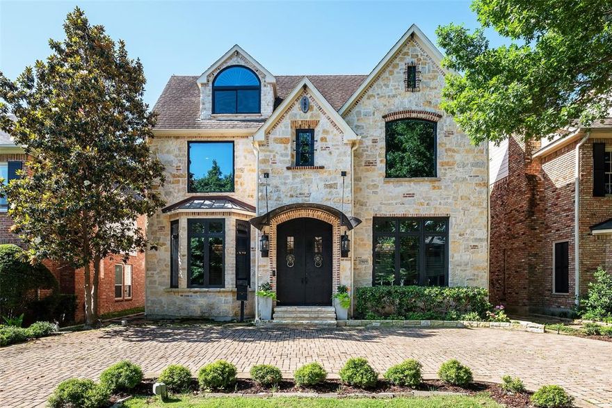 French transitional Terry Woldt built home offers substantial room for living and entertaining with nearly 6,000 sqft on this quiet street in coveted Boone Elementary of Highland Park ISD. Gracious split formals combine traditional functionality with a more open, transitional style. Dining room and butler's pantry lead to modern chef's kitchen with Wolf and Miele appliances. Dedicated study separates the formal living from a spacious, warm den with wood beams and a stone fireplace. Front and rear staircases lead to the primary suite which boasts a private balcony, marble bath and dual closets, while three additional en suite bedrooms and a theater room complete the second floor. Third floor features a fifth en suite bedroom that could serve as a private nanny suite or second home office. Circle drive, automatic gate to rear garage and incredible storage make for convenient living. Close-in central location near US 75 and walking distance to SMU and restaurants and shops of Snider Plaza