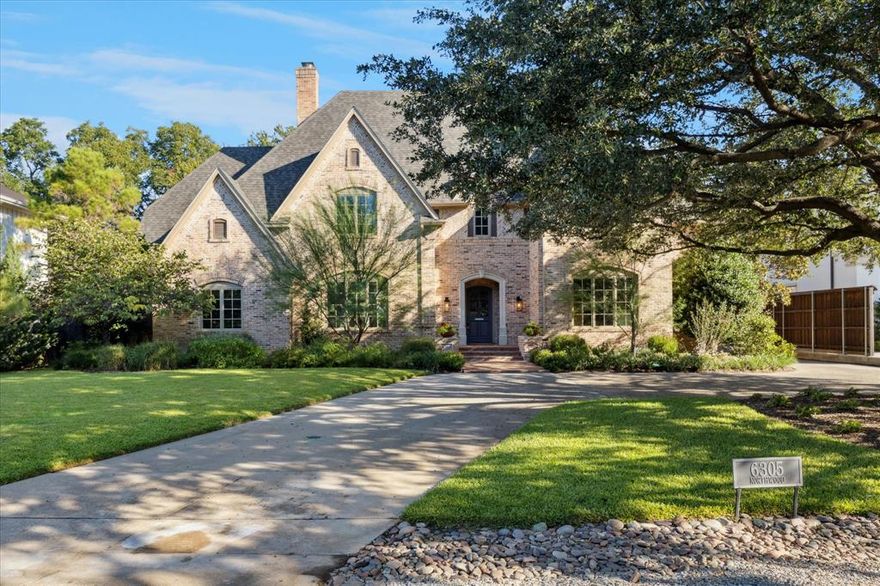 Approach this exquisitely updated Preston Hollow residence with designer touches throughout. Just imagine tailoring it to your preferred style—contemporary, traditional, modern, or today’s favored transitional design. With timeless elegance, the home provides a versatile canvas that complements any décor. Set on a landscaped, close to half-acre lot with mature trees, it combines sophistication with comfort, and now includes a new roof and freshly painted interiors for a move-in-ready experience. Enter grand foyer, where with the latest in design, a bubble chandelier highlights the inviting staircase. Gleaming hardwood floors flow throughout downstairs, guiding you into the gracious living room with one of two fireplaces, walls of windows that fill the space with natural light and a wet bar with wine chiller—perfect for entertainment or personal enjoyment.  Off the living room, a generous office features custom shelving and built-ins. Across the foyer, the formal dining room overlook a majestic oak and butler’s pantry nearby to showcase fine serving pieces and support unforgettable dinners. The Gourmet Kitchen features a Sub-Zero refrigerator, Viking range, quartz counters, abundant cabinetry and custom pantry. It opens seamlessly to casual dining area and Great room with stone fireplace and custom cabinetry create an inviting centerpiece. Expansive windows frame views of the sparkling pool, lush yard, and outdoor play space. A  serene primary suite offers dual vanities, Hollywood shower, soaking tub, and dual walk-in closets—an ideal retreat. Upstairs, accessed by front or rear staircases, provide recently installed carpet, 4 large bedrooms, one with jack-jill bath and versatile game room and space for card or board games. Other highlights include two combined garages plus a third garage for vehicles or storage. This exceptional home delivers refined living, quality craftsmanship, and indoor-outdoor elegance in one of Dallas’ most prestigious neighborhoods.