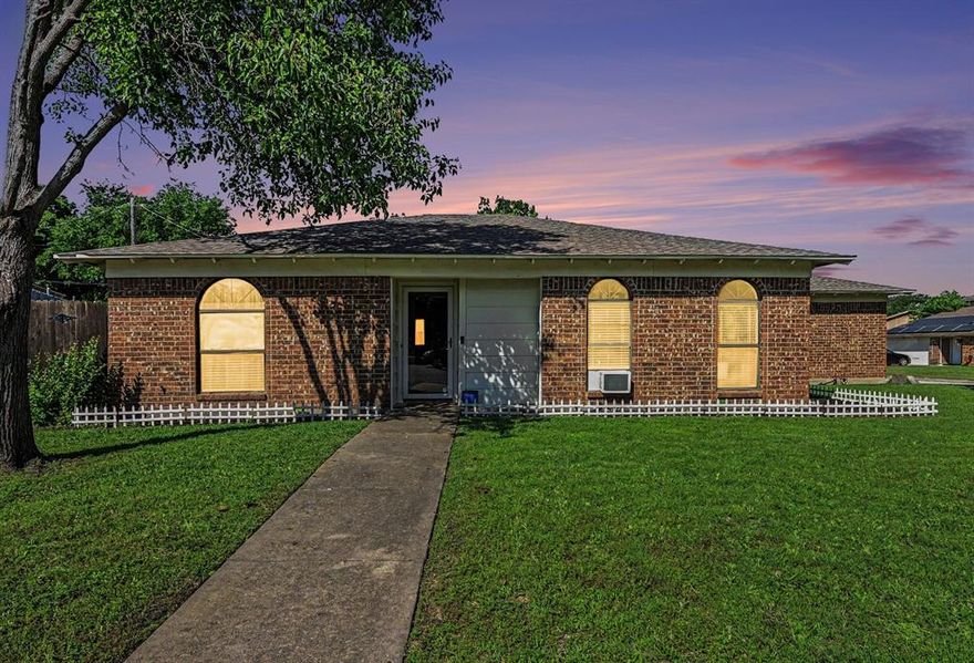 Charming single-story home on a spacious corner lot featuring vaulted ceilings, crown molding, and wood-look flooring throughout. The inviting living room centers around a cozy fireplace, while the primary bedroom includes a full private bath. A functional layout also offers a utility room and all appliances included for added convenience. Enjoy a fenced backyard with a double-gate privacy fence—perfect for extra parking or easy access. A rare find you won’t want to miss!Discounted rate options and no lender fee future refinancing may be available for qualified buyers of this home.