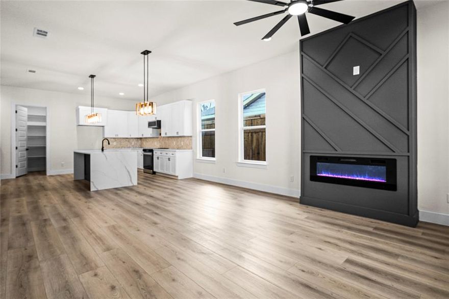 Modern farmhouse new construction, priced at market to sell.

Set on a quiet residential street just one minute from the train station, this move-in-ready home offers clean lines, thoughtful design, and everyday comfort in a highly convenient Dallas location.

The open living area is centered around a fireplace and connects seamlessly to a well-designed kitchen with premium appliances, a five-burner gas range, waterfall island, and pot filler; features that balance style with function.

The primary suite serves as a private retreat with its own fireplace, chandelier, and freestanding soaking tub. Eleven-foot ceilings and eight-foot interior doors throughout create a bright, open feel, complemented by practical upgrades such as pop-up outlets, USB ports, and wireless charging.

Covered front and rear porches with stained cedar posts, a newly installed lawn, and an eight-foot privacy fence complete the outdoor space. A two-car garage and ample parking provide everyday convenience.

Well built, thoughtfully finished, and ready for its first owner. Seller includes a 1-2-10 builder warranty. Additional incentives available with use of preferred lender. Contact listing agent for details.