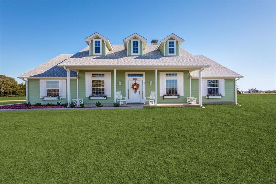 Great opportunity to own a signature house sitting on a majestic hill with breathtaking sunsets.  The peaceful tranquility from your front porch is unparalleled.  The acreage and tree lines have been cleared and the home has been restored.  A sunny, light, bright ambiance will thrill you with an abundance of natural light.  Recent improvements and upgrades include: Roof, all windows, Heater, Air Conditioner, light fixtures, hot water heater, sidewalks and  interior and exterior paint.  The open, white kitchen is a delight with all new appliances, quartz countertops, large walk-in pantry and oversized desk.  The floorplan has split bedrooms and presently the fourth bedroom is used as an additional living area, it would also make a great study!  The master bedroom boasts an ensuite bath, sitting area and a door to the outside.  The front porch is covered and runs the entire length of the front of the house.  The large back covered patio has a vaulted ceiling.  Large oversized 2+ garage!