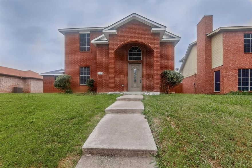 Efficiently designed, this home lives larger than its footprint suggests. It offers two spacious living areas, with the primary bedroom conveniently located on the first floor and two additional bedrooms upstairs. The home features a two-car garage and a dedicated utility room.

The living room is highlighted by a cozy wood-burning fireplace, creating a warm focal point. Fresh paint throughout and brand-new carpeting give the home a clean, move-in-ready feel. Step outside to enjoy a generously sized, fenced backyard—perfect for relaxing or entertaining.