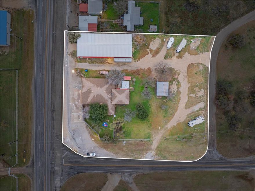 TURNKEY BUSINESS OPPORTUNITY! Unique general store equipped with bait shop including 4 minnow tanks, half bath, fountain coke machine, coolers, shelving, indoor & outdoor fenced sitting areas attached to front of 3 BR 3 bath brick home having 4326 sq ft, sitting on 1.7 acre corner lot & US HWY 180 frontage, featuring approximately 50x120 metal building on slab for boat & or RV storage, 9 RV spots with large metal building on slab makes a great area for rec room furnished with full bathroom & wd hookups. New central air, ceiling fans throughout home, white brick fire place in 1 of 2 spacious living areas. Over-sized kitchen & dining area with island, tile floor, built in oven, dishwasher, chandelier. 2BR 2bath downstairs & 1 BR & full bath upstairs. Ensuites in master & upstairs. 2 large interior storage rooms. Private fenced back patio & yard. Attached 900 sq ft 2 car garage with room to accommodate RV & or boat. Buyer and or buyer's agent to verify all information.