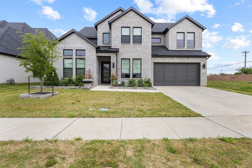 Step into a home that truly has it all—better than new and designed for both everyday comfort and unforgettable entertaining. This stunning 5 bedroom, 5.5 bath with 3 car garage Madison II plan welcomes you with a grand two-story foyer that sets the tone for the spacious elegance found throughout.

Just off the entry, you’ll find a large private study, perfect for working from home, while a guest suite (or ideal child’s room) with its own full bath sits on the opposite side. The main level also features a dedicated media room—perfect for cozy family movie nights.

At the heart of the home is a breathtaking family room with soaring ceilings, exposed beams, and a striking fireplace. The open-concept kitchen is a dream, offering endless cabinet and counter space, plus an oversized eat-in area with a charming wraparound window seat—ideal for gatherings of any size.

The primary suite is truly exceptional, featuring high ceilings with beams, a spa-inspired bath with an expansive shower and soaking tub, and a massive walk-in closet designed to keep everything beautifully organized.

Step outside to your own private retreat. The backyard is built for entertaining, complete with a sparkling pool, outdoor kitchen and BBQ, plenty of seating space, and even an outdoor shower—perfect for enjoying warm Texas days.

Upstairs, the home continues to impress with a spacious gameroom, second study, flexible living space, abundant storage, and three additional bedrooms—each with its own private bath.

Additional upgrades include motorized and smart-programmed shades on the first floor, an epoxy-coated garage with storage racks, and a water softener system with reverse osmosis filtration.

3 minutes to 75 and 121 so very easy access to highways, shopping, fun and food. 

This is more than a home—it’s the lifestyle you’ve been waiting for.