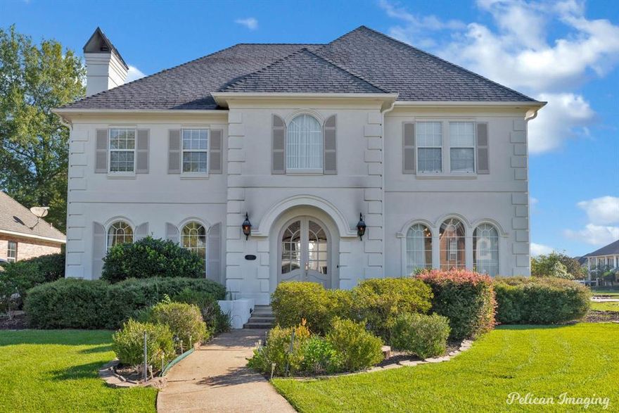 Beautiful three-story French Provincial home situated on a corner lot in a gated community. Freshly painted neutral interior. Formal living and dining rooms plus a den with gas fireplace and wood flooring. Kitchen offers freshly painted cabinetry, black appliances and the refrigerator remains. There is a half bathroom downstairs for guests. Four bedrooms are located on the second floor. Two bedrooms share a Jack and Jill style bathroom and the 3rd bedroom offers a private bath. The primary suite features a remodeled bath (2025) with free-standing tub, separate stall shower, double vanities, and walk-in closet. Third floor offers a large bonus room ideal for a media, game, or exercise room.  This home combines sophistication and function in the desirable Stonebridge community.