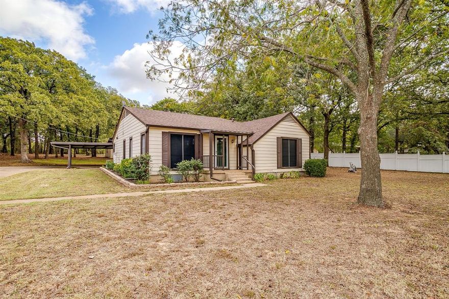 Pride ownership evident in this home. Located in MANSFIELD ISD on 1.15 acres. This quiet serene street offers the slow down of country living just minutes aways from city amenities. The best of both worlds. The layout offers opportunity for re-design and making it your own. Currently 2 bedroom, 1 bath with 2 large living spaces, dining room and eat in kitchen. Kitchen has crisp white cabinets, double ovens, dishwasher and breakfast area. Outside fall in love with the tranquility that is your backyard. Abundance of Oak trees, space and privacy. There is currently a storage building with a loft.