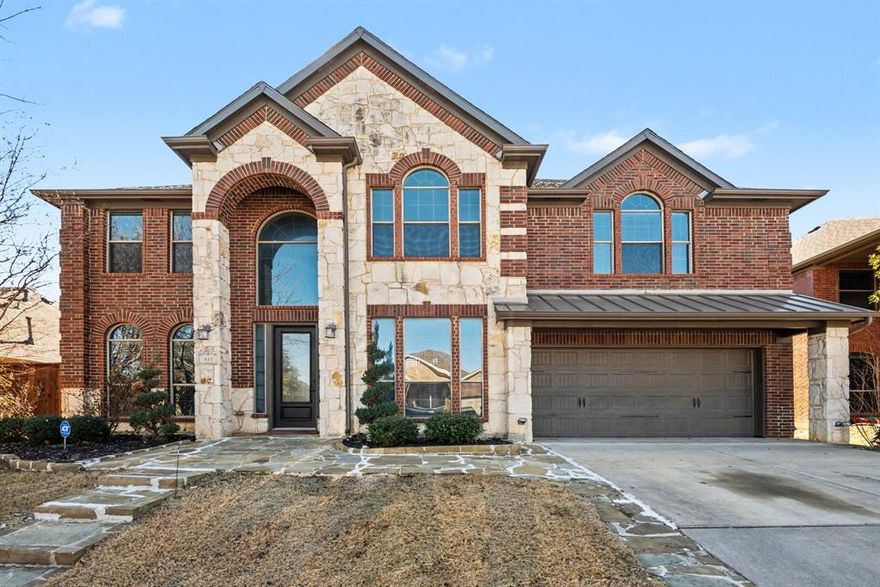 Experience modern living in this bright, airy home with a grand entrance and dramatic upper level catwalk. The main level features low maintenance flooring, while upper level bedrooms are cozy with carpet. The chef inspired kitchen boasts a huge center island with breakfast bar, granite countertops, and plenty of space for entertaining. The primary suite on the main level offers a spa like ensuite with soaking tub, separate shower, and dual vanities.

Upstairs, unwind in the game room or enjoy movie nights in the tiered media room. A formal sitting room, flexible home office with glass French doors, and a patio overlooking the fenced backyard complete the space. Residents enjoy HOA perks including a pool, playgrounds, walking trails, and green spaces. Conveniently located near I-35W, Hwy 114, shopping, dining, and Texas Motor Speedway, this home combines style, comfort, and lifestyle—schedule your tour today!

Discounted rate options and no lender fee future refinancing may be available from preferred lender for qualified buyers of this home.