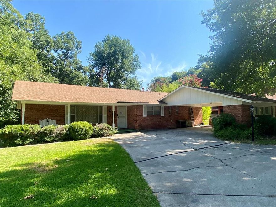 Great location, welcome home to Historic Gainesville!  Just south of downtown, you will find the quietest little spot on Tennie St with fantastic, established trees and warm, neighborhood vibes.  This 3 bed, 2 bath brick home is ready for a facelift and for you to put a fresh touch on it.  The lot sits on .31 acres, has a circular driveway and an oversized carport. Jack and Jill Guest Bath with tiled shower, decent sized bedrooms, and incredible storage throughout the home.  Stainless Steel appliances and double oven accent the kitchen. The backyard is fenced,  has a storage shed on it, and it's buffered by a nice line of trees around the entire perimeter.  It's the ideal yard for dogs and kids to play privately and safely.  Please note this property sits half way outside the FEMA flood zone and half way inside the 500 yr floodplain. There is a filed FEMA revision titled Pecan Creek North, dated Apr 27, 2016 and two lenders have stated this home does NOT require flood insurance.