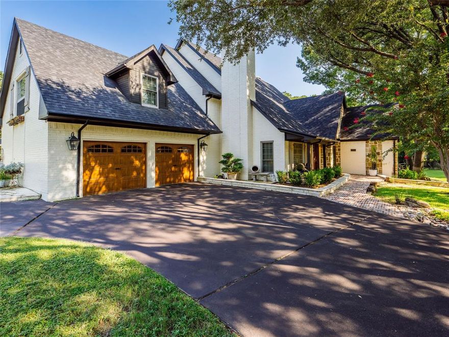 Completely remodeled custom estate on nearly half an acre in the heart of Coppell. Exceptional curb appeal with a circle drive, lush landscaping, and a welcoming front porch. This 3,843 square foot home features refinished hardwood floors, soaring ceilings, and two beautiful stacked stone fireplaces. The chefs kitchen is a standout with custom cabinetry, a high-end gas range, and a large center island. The luxurious primary suite offers a spa-like bath with a freestanding tub and a private balcony overlooking the backyard. Additional versatility is provided by a second primary suite, a game room, and a flexible downstairs bedroom that can serve as an office. The expansive backyard oasis includes a wrap-around patio, a fire pit, and scenic views, all while being adjacent to a peaceful greenbelt. Conveniently located near top-rated Coppell ISD schools, shopping, dining, and DFW Airport. This home perfectly combines modern luxury with a prime location.