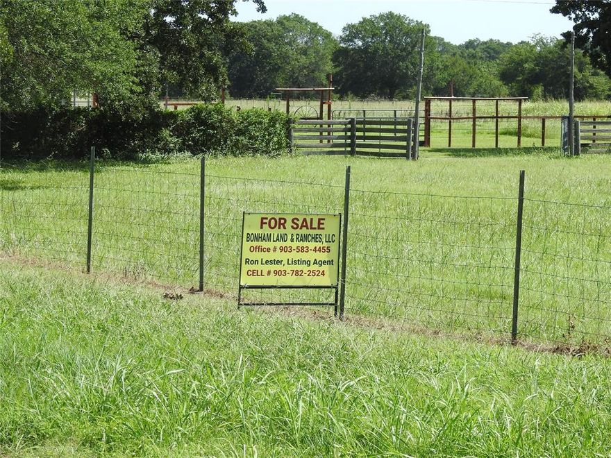 Great location for a new home with enough acreage for a few pets with the boundary. Good grass, mixed trees and nice location for a stock pond. Located at the corner of Hwy 78 and County road 2515,  approx. 5 miles North of Bonham and approx. 6 miles from the Red River on State Hwy 78  and approx. 35 miles to the McKinney, TX area. Good sandy land, good barbed wire fence, White shed Water Supply on the road as well as electrical utilities. Build a home or two homes and it is restricted to site built homes only. No mobile homes or camper camp grounds.
Call Ron Lester at 903-782-2524 to schedule showing.
