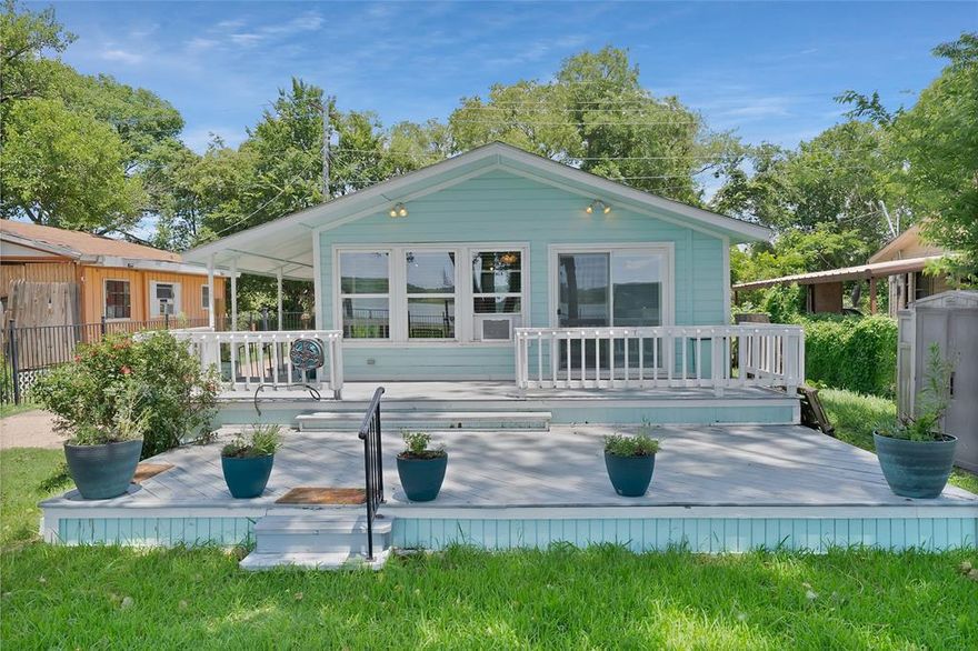 Enjoy breathtaking lake views every morning from this charming 1 bedroom, 1 bath lakefront retreat on beautiful Weatherford Lake. Whether you're looking for a peaceful weekend getaway or a cozy full time residence, this property offers the perfect escape from the hustle and bustle of everyday life. Just steps from your front door, you'll find a private dock and boat launch, ideal for fishing, boating, or simply unwinding by the water. Surrounded by mature shade trees, the home features two spacious back porches where you can relax and soak in the serene lake views. Conveniently located only 10 minutes from local shopping and dining, 25 minutes to Fort Worth, and 55 minutes to DFW International Airport, this lakeside retreat combines comfort, nature, and accessibility. Don't miss this rare opportunity to own a slice of paradise on Weatherford Lake. Schedule your showing today and start living the lake life you've been dreaming of.