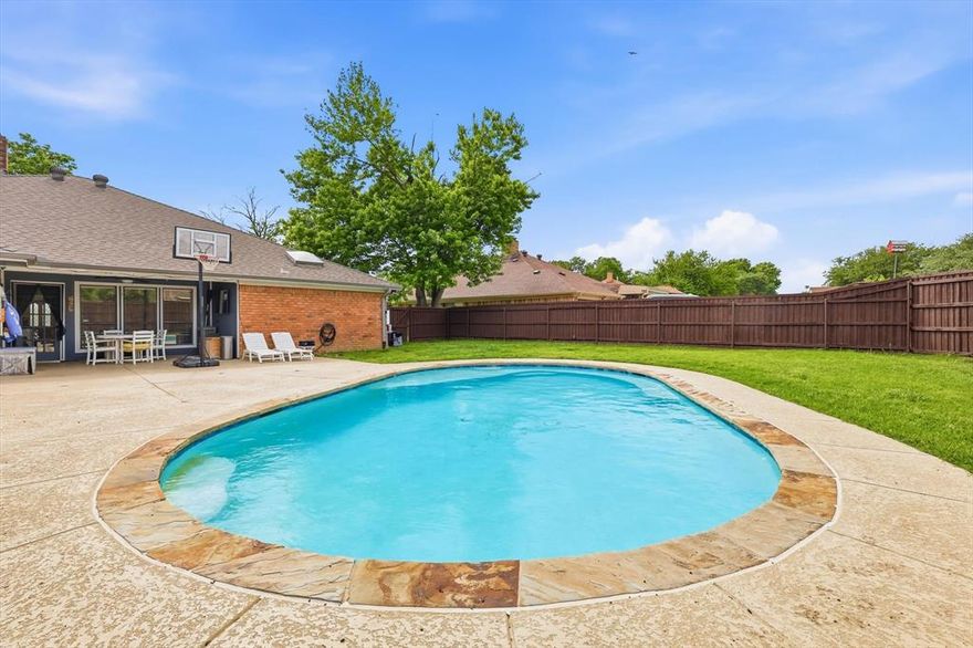 One-story with gas heated pool! Seriously this is a move in ready home, well maintained. Home is located in a NON HOA community known for its well-kept homes, it's a peaceful place with a strong sense of community. The 2025 updated kitchen is a true highlight, featuring sleek quartz countertops and stainless steel appliances. Adjacent to the kitchen is a large dining room with a wet bar, perfect for entertaining guests. The living room offers a spacious retreat with vaulted ceilings and a cozy gas brick fireplace, creating the perfect atmosphere for relaxation. Gorgeous porcelain wood-like floors flow seamlessly throughout all of the living spaces. Not only do they add warmth and elegance, but they are also incredibly easy to clean and maintain. The primary suite is a peaceful retreat, complete with dual closets and dual sinks in the en-suite bath. Home has 3 additional spacious bedrooms, 2 baths, and an office with built-ins. Also 2 living areas so everyone can have their space. The utility room is enhanced with a stylish barn door, adding a touch of character to this practical space. Step outside to the incredible .23 acre backyard oasis. Take a walk around the sparkling inground pool, covered patio and plenty of manicured yard to enjoy.  The home also includes a two-car garage and is located in a highly desirable area of Lewisville, offering easy access to local amenities and Home is also close to local schools and parks, making it ideal for families. UPDATES:  2025 kitchen remodel, new carpet, new windows in front room and primary bedroom, Fence stained. 2023: wifi irrigation installed.  2021: all new ceiling fans 2018:  Porcelain floors, Level 4 shingle roof. and new HVAC.  2017: pool built, gas heater for pool, French drains add to backyard and a lifetime transferable warranty.