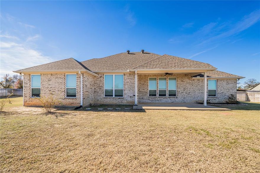 Great location in a great area of Lindale. Welcome your guests in the cozy enclave right inside the front door. When entering the living area the first thing you notice is the wall of windows overlooking the patio. The living area features beautiful crown molding, and a shiplap accent wall. The open concept allows you to cook in the kitchen and visit with friends and family. The island has room for stools. There is a large walk-in pantry and plenty of storage in the kitchen.  The neutral colors in this home create a warm, cozy ambiance that complements any décor.  The home is located outside of town, with a feeling of being in the countryside, but in an established neighborhood, and is just minutes from I-20.   Do not pass this one up. Come see your next home