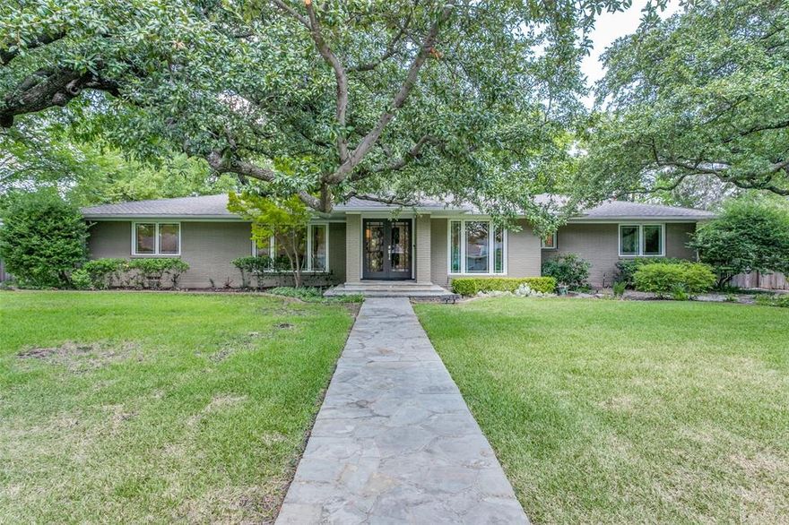 Exquisitely remodeled single story ranch-style home in Preston Hollow. Kitchen is open to the family room & has Carrara Quartz countertops, over-sized island, Jenn-Air appliances, gas cooktop, double ovens, farm sink & walk-in pantry.  The breakfast room has tons of windows for natural light.  Gorgeous hardwood flooring throughout – no carpet!  Both guest rooms boast en-suite baths!  The large owner's suite has abundant windows with panoramic view to the backyard.  Luxurious bath with frameless glass shower, freestanding soaking tub, separate vanities & two-sided closet with built-ins. An office with glass French doors plus game room with built-ins. Spacious laundry room has a sink & tons of cabinets. Generous backyard with a large deck, mature trees & plenty of room for a pool. Rear entry garage with electric gate.  Premier location close to Preston Center for shopping & dining!