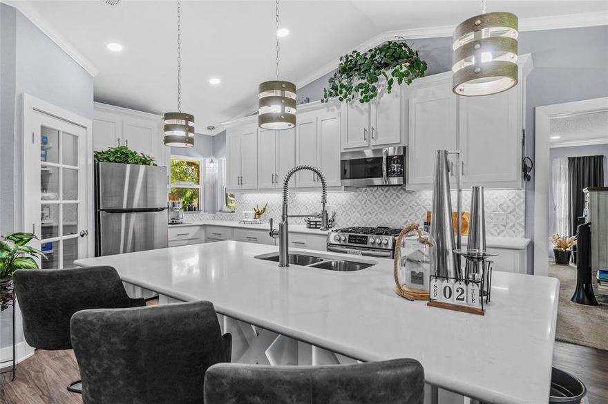 Don’t miss this rare opportunity to own 1.796 acres just outside of town, desirably priced to move quickly! This beautifully remodeled home completed in 2021 offers modern style, thoughtful upgrades, and plenty of space both inside and out.
Step inside to find gorgeous quartz countertops throughout with the island plumbed already for a disposer if you wanted to add one. Waterproof luxury vinyl flooring in the main living areas, and warm neutral colors that create an inviting feel. The kitchen is truly stunning with abundant cabinetry, a walk-in pantry, a natural gas stove, and an open layout that flows seamlessly into the dining and living areas. Cozy up by the gas or wood-burning fireplace this winter with plenty seasoned firewood included and ready to go!
The spacious split-bedroom design ensures privacy. Guest bedrooms are generously sized, while the primary suite boasts a mirrored wall of closets, plus an additional oversized closet in the ensuite bathroom.
Additional highlights include a heated and cooled 2-car garage with side entrance and half bath. Circle drive with porte-cochère for easy front-door access. Fully fenced backyard with a large covered porch ideal for year-round enjoyment with plenty of room to add a pool or just let your imagination go wild with what you can create out back. Two septic tanks, dual water meters, and an extra electric pole ready for a meter, perfect for adding a tiny home, guest house, Airbnb, or rental opportunity. Seller had a tiny home set up at one time. All this just minutes from downtown Denison with shopping, restaurants and events to go and enjoy. Bonus, the seller is leaving the riding lawn mower with extra blades to keep the property looking great. Call your favorite Realtor today to schedule a showing and see what all this Gorgeous home has to offer.
2 hour notice and preapproval letter needed prior to showing.