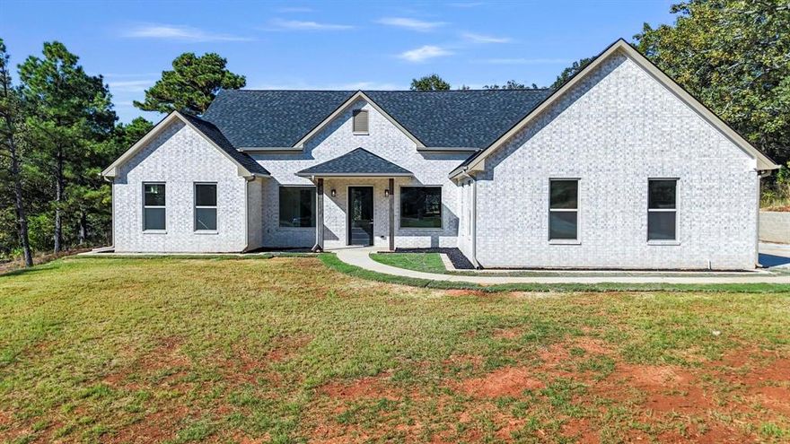 Welcome to your dream home in the beautiful and gated Dove Ridge Subdivision of Lindale, TX! Nestled on 1 picturesque acre, this brand new construction offers the perfect blend of luxury, functionality, and peaceful country living—all within the highly sought-after Lindale ISD and just minutes from I-20 and Toll Road 49 for easy commuting. This thoughtfully designed home features 4 bedrooms and 2.5 bathrooms, or 3 bedrooms with a dedicated office, ideal for modern living. Step inside to find a spacious living room with a soaring vaulted ceiling and abundant natural light streaming through large windows that highlight the open layout. The gourmet kitchen is a true showstopper, boasting high-end appliances, stunning countertops, and a huge walk-in pantry—perfect for entertaining or everyday living. The primary suite is a peaceful retreat with a large bedroom, a spa-like bathroom with upscale finishes, and an impressive walk-in closet that conveniently connects directly to the laundry room. Whether you're sipping coffee on the back porch or watching wildlife roam, you'll love the serenity of life just outside city limits. With abundant wildlife and gorgeous views, this is the quiet country living you've been waiting for—without sacrificing convenience. Don't miss your chance to own a beautiful new home in one of Lindale’s premier gated communities. Schedule your private showing today!